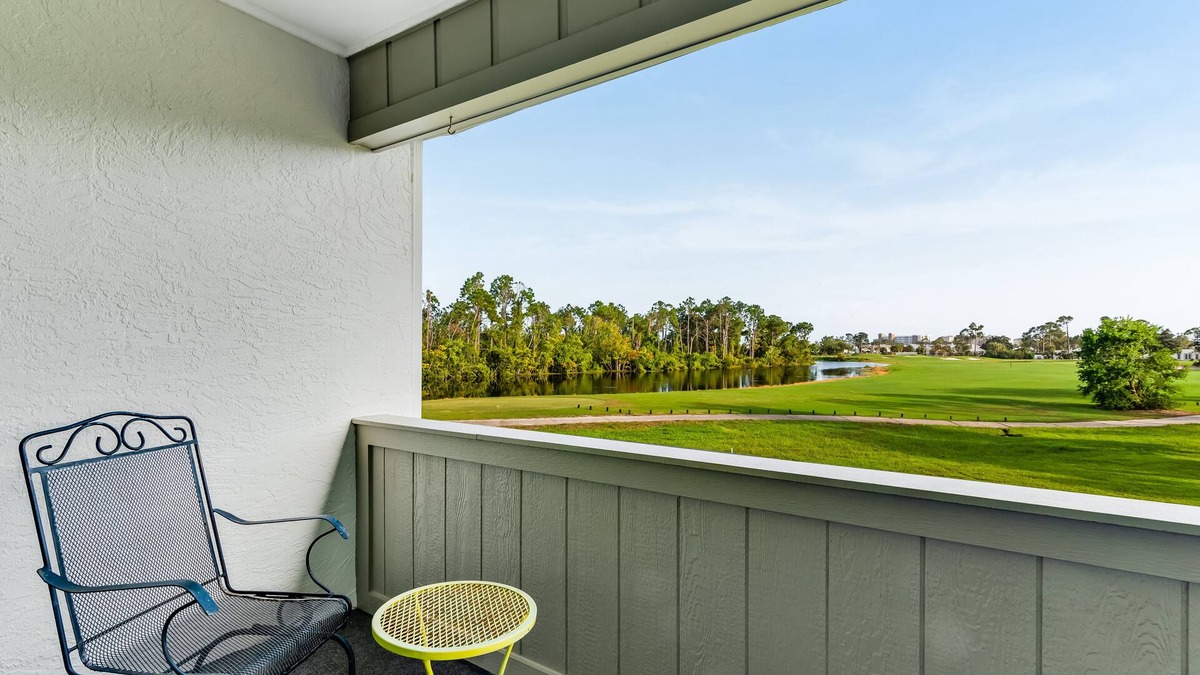 Upper Grand Lagoon Condo | Golf course-adjacent home with shuffleboard table & furnished patio