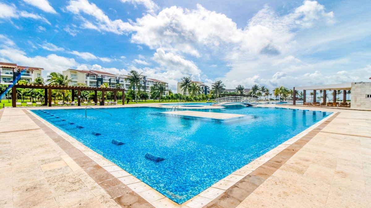 Puerto Juarez Apartment | Gorgeous apartment with on-site pool, fitness center, & balcony