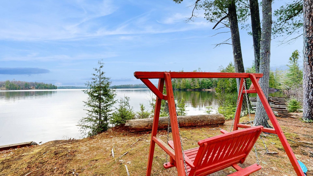 Three Lakes House | Gorgeous lakefront lodge with dock, deck, game room & firepit