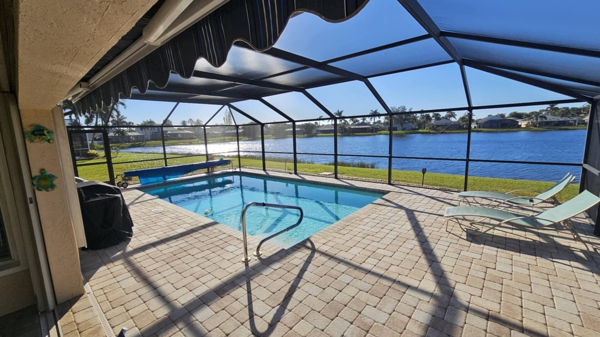 Beachwalk Isles House | Gorgeous sunsets over the lake with heated pool! Close to beaches and golf