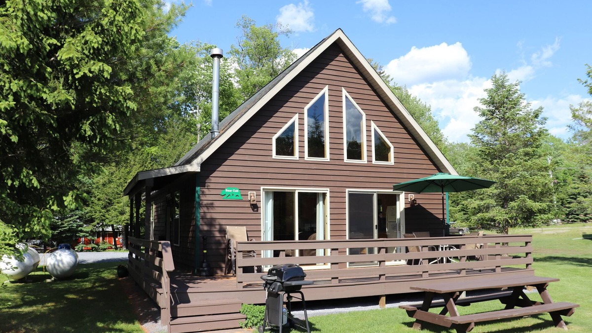 Inlet Cabin | Gorgeous view of the lake from a private deck along with 160 feet of sandy beach
