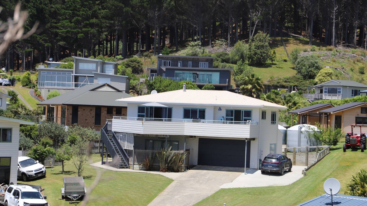 Opito Bay House | Great views, great family bach, super close to the beach and a spa pool!