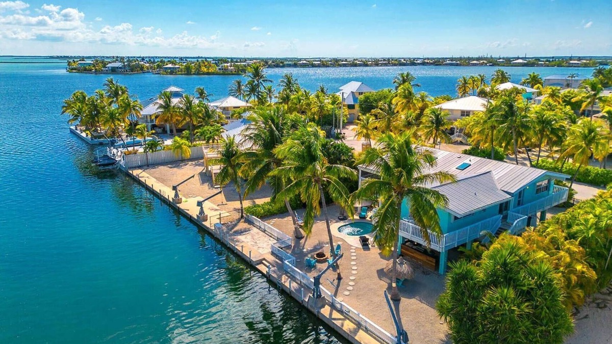 Sugarloaf Shores House | Green Turtle Oasis: Lovely 4BR Canal Front Home, Pool, Dockage, Tiki, Outdoor Dining & Pet Friendly!