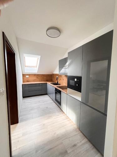 Hlohovec Apartment | Grey Apartment Hlohovec