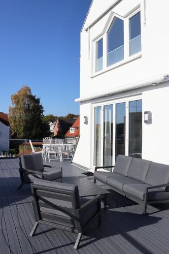 Sierksdorf Apartment | Große Penthouse Ferienwohnung mit Meerblick, Sonnenterrasse & Luxusbad von "Momentic"