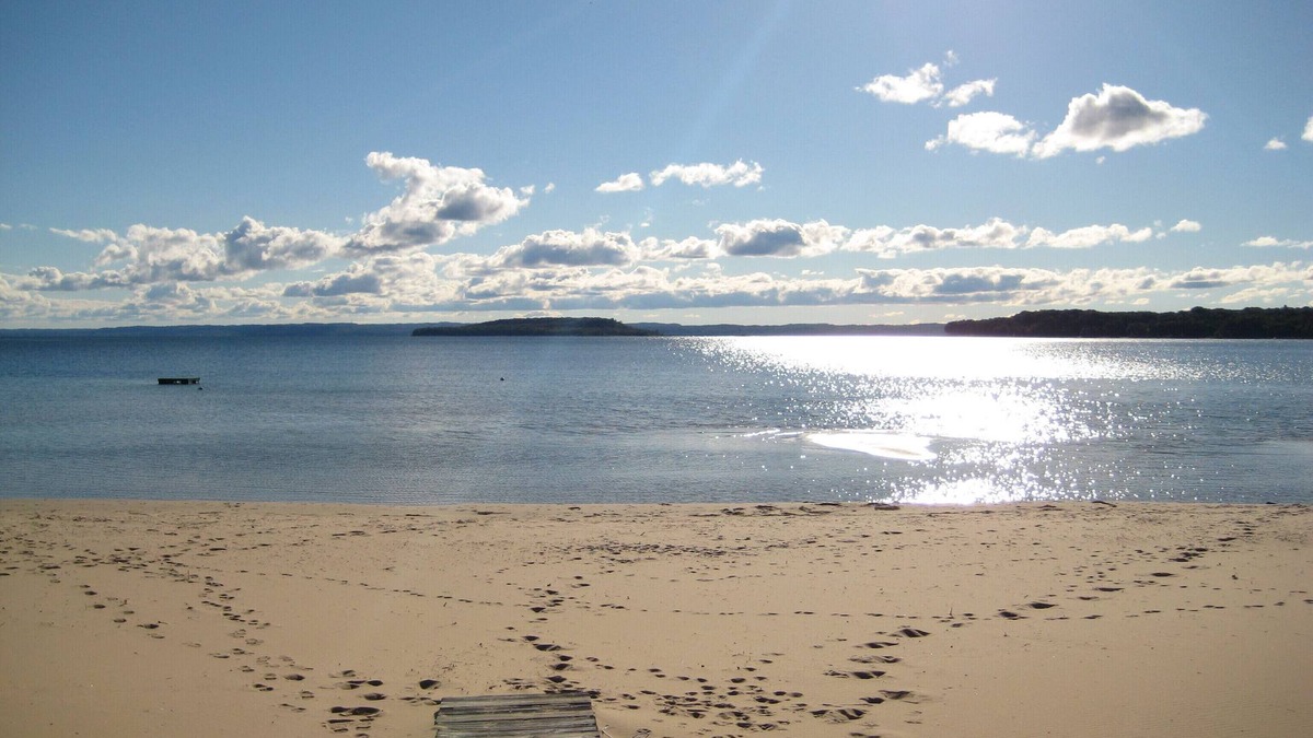 Traverse City House | Guest House on Old Mission, Pure Sand Beach, Sunset, Wineries, A Couple Respite.