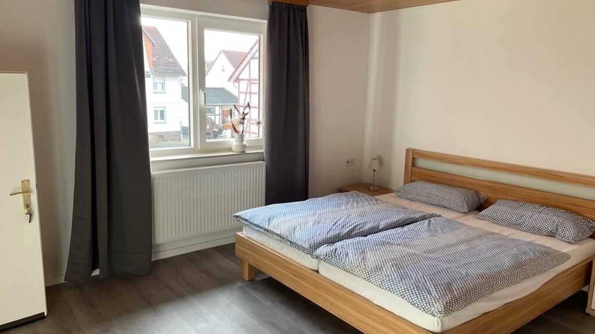 Alheim Apartment | Guest room with private bathroom, in a vacation home, centrally located