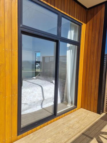 Clarks Beach Apartment | Harbour and rural views