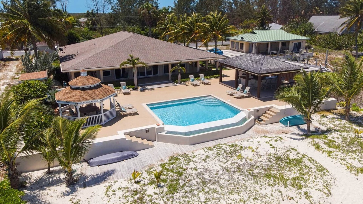 Rokers Point House | Hart House, vast patio with hot tub, heated pool & outdoor bar on Flamingo Bay