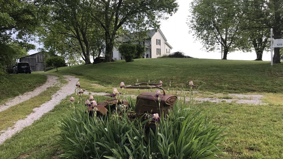 Carlisle House | Hilltop Farmhouse with sunrise sunset porch overlooking hills and holler