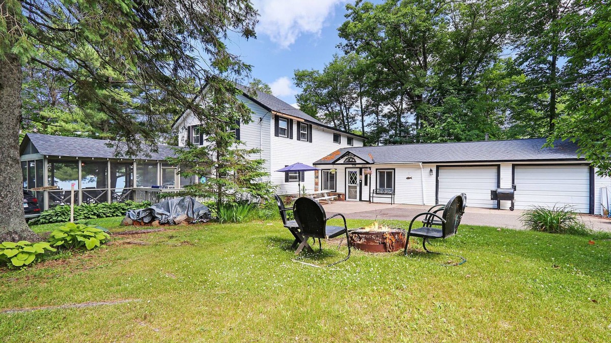 Stone Lake House | Historic Lake Front Home w/150' lake front on pristine Stone Lake walk to town