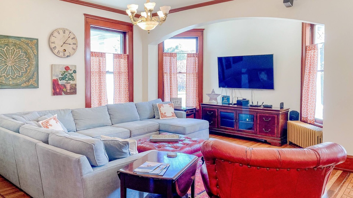 Manistee House | Historical dog-friendly home with fenced yard, grill, Ping-Pong, fireplace, & AC