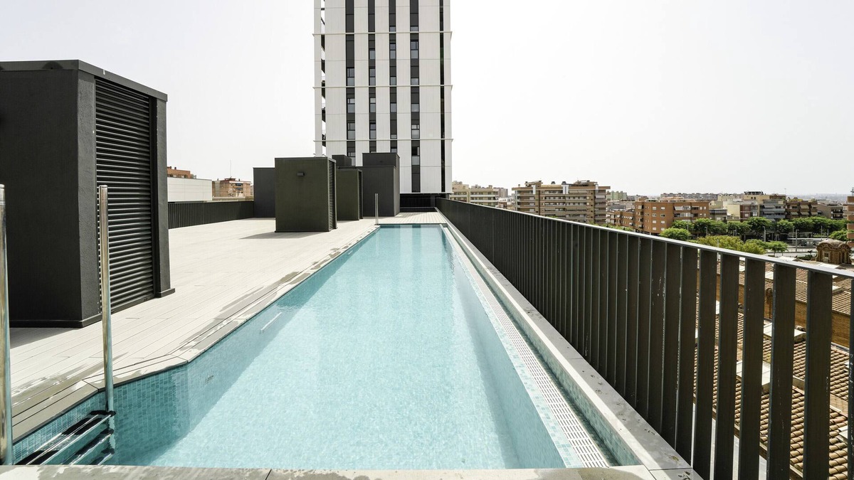 Cornella de Llobregat Apartment | Holiday Apartment "Sunsets and The Pool In Barcelona" with Balcony, Shared Pool & Wi-Fi