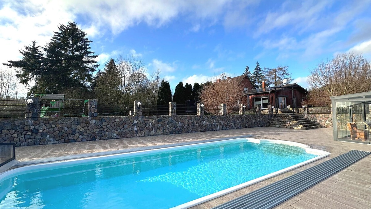 Dolgen am See House | Holiday Home MILA with Pool, Sauna, and Large Private Grounds