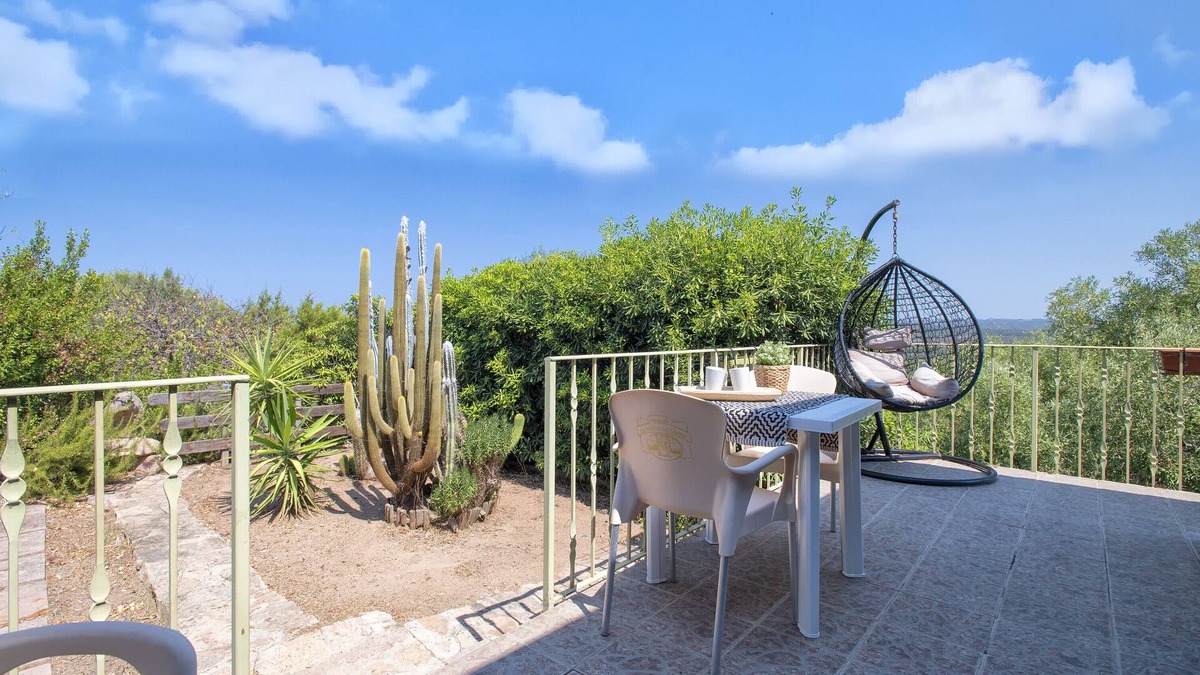 Paduledda House | Holiday Home "Vista Mozzafiato ad Isola Rossa" with Sea View, Private Terrace & A/C