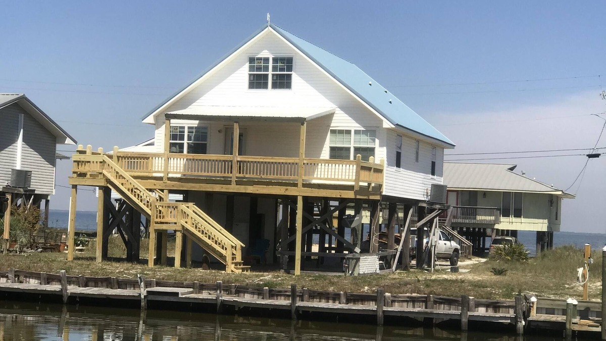 Silver Cay House | Home on water w/boat dock. 3 bed, 3 bath. Sleeps 9. Sunsets, beaches, fishing.