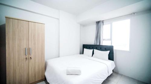 Sidoarjo Apartment | Homey 2BR Apartment at Suncity Residence By Travelio