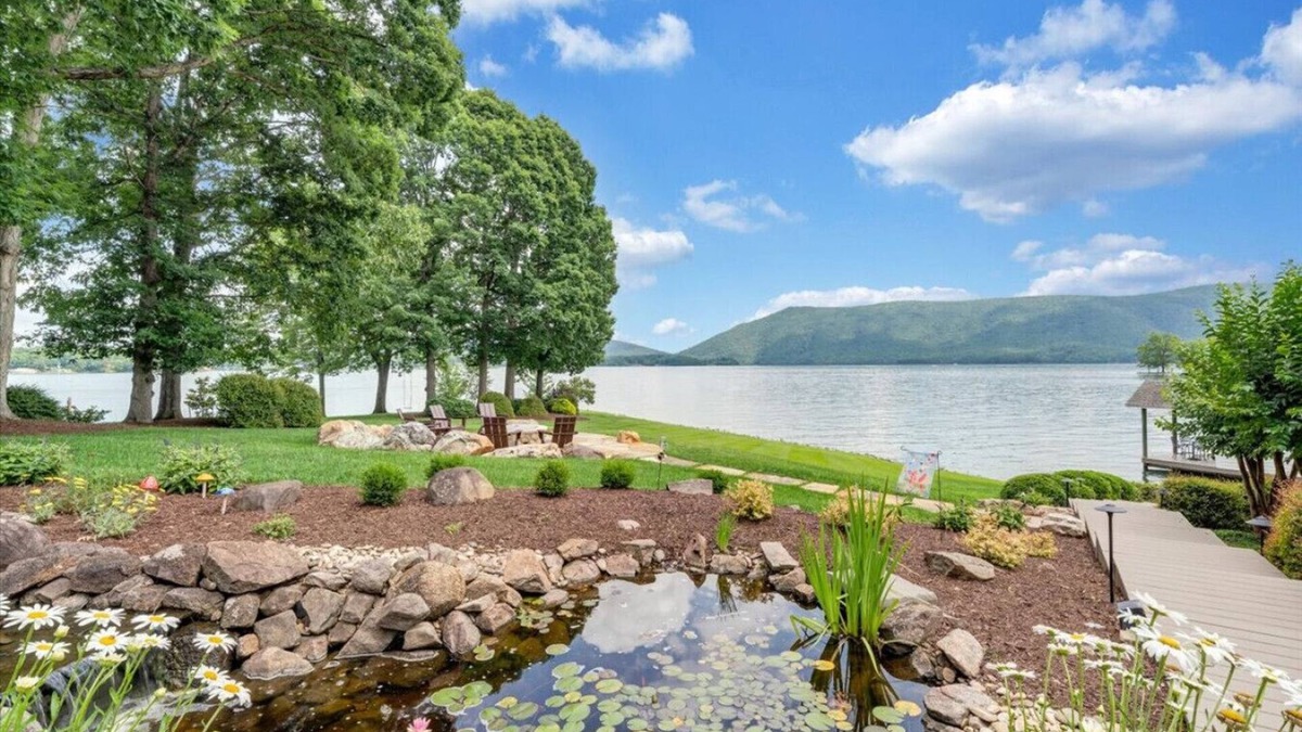 Huddleston House | Hook & Paddle - Luxury home on SML with kayaks and private dock.