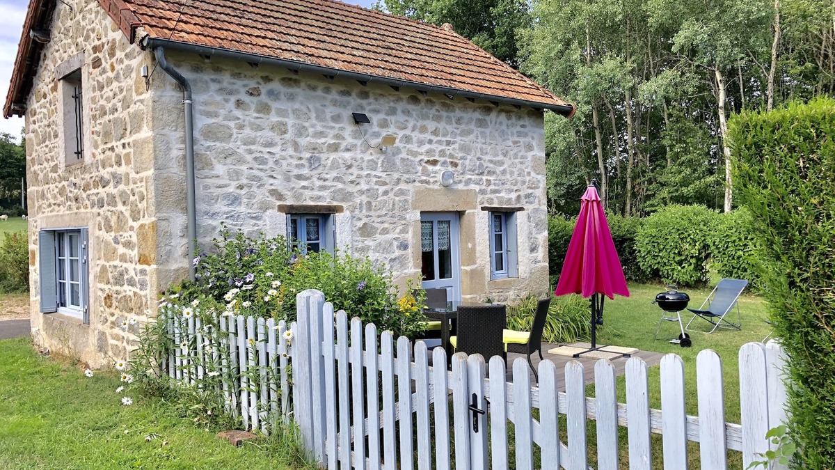Gouttieres House | House made of regional stones, typical from Auvergne, greenery landscape