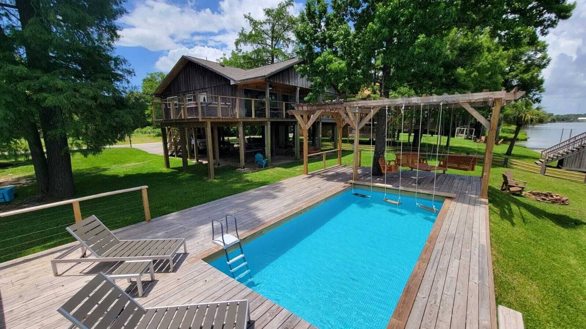 Barrett House | Houston Riverfront Getaway house with pool and hot tub