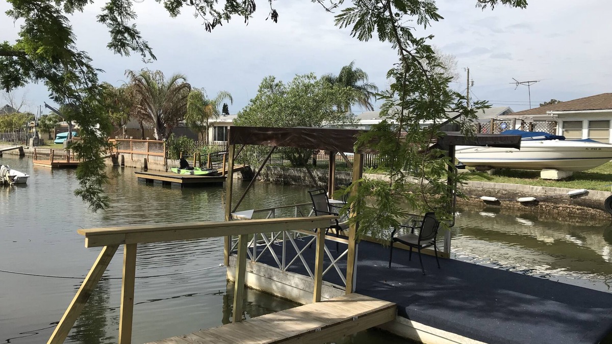 Hudson House | Hudson Beach Waterfront House with dock and canoe