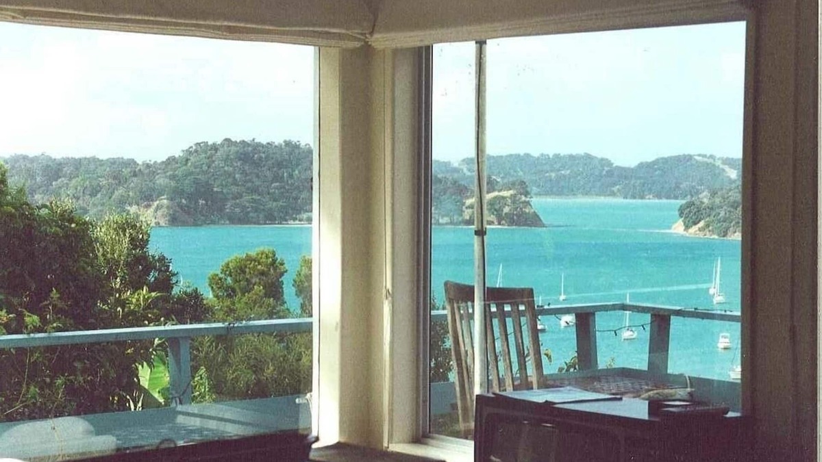 Mahurangi West Cottage | Iconic New Zealand beach cottage with elevated harbour and bush views.