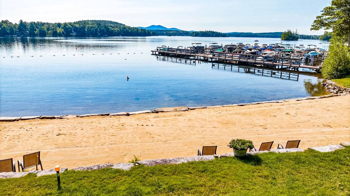 Meredith House | Idyllic lake retreat with beach access, firepit, wraparound porch, & great views