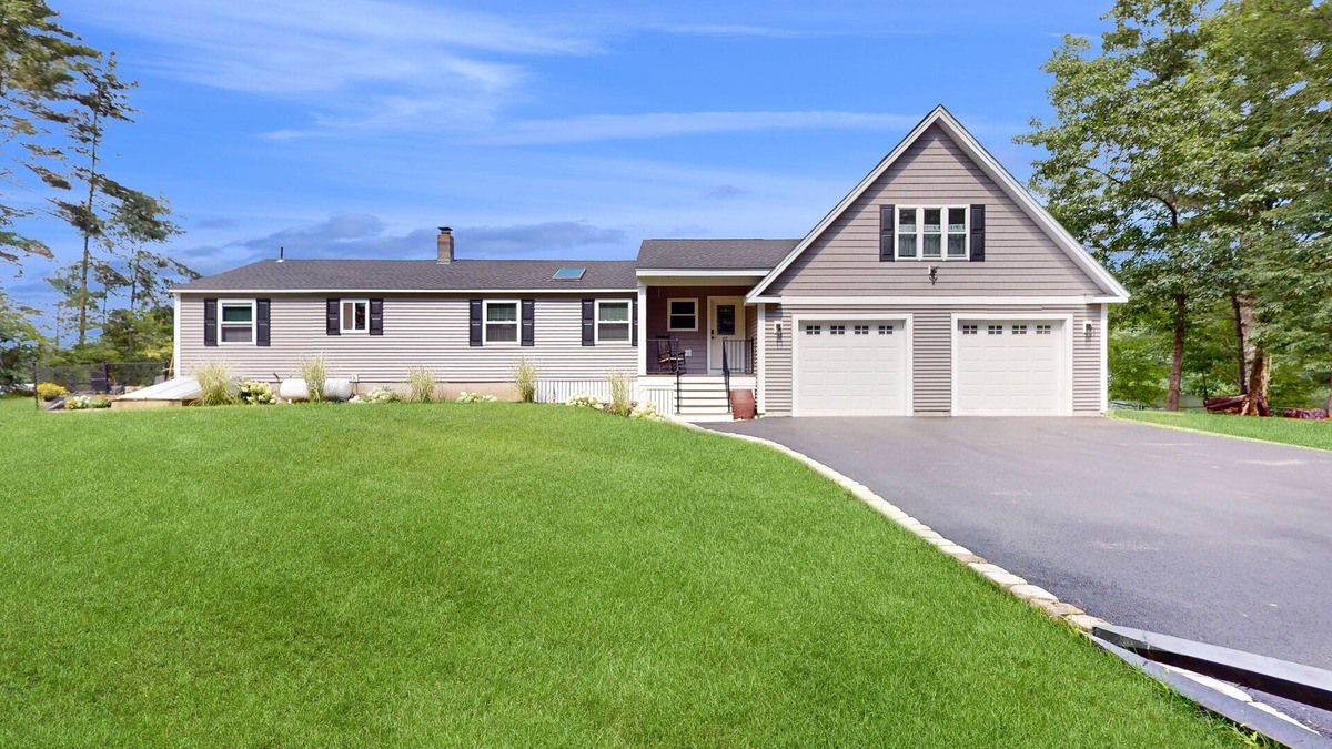 Manchester House | Idyllic & sunny lakefront home with large patio & views - near golf & skiing