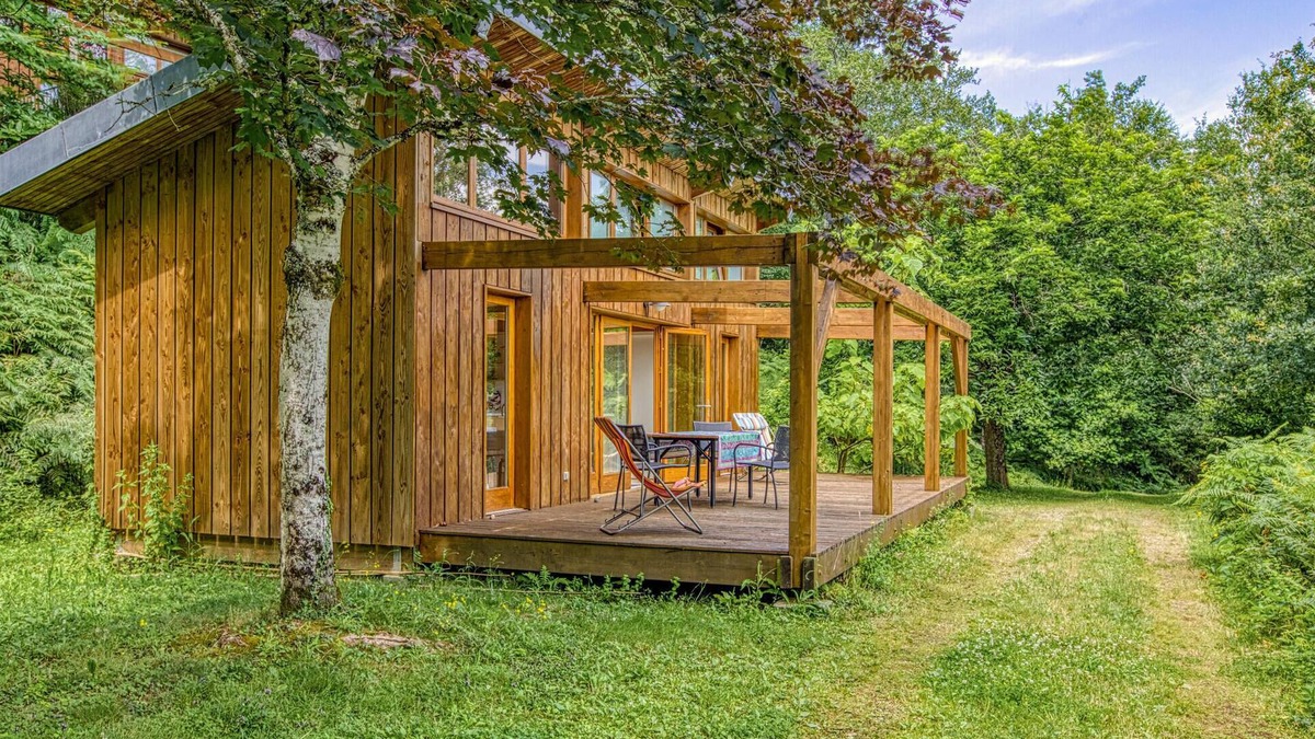 Mirandol-Bourgnounac House | In idyllic location of a forest and near the river Vaur is this cozy wooden house.
