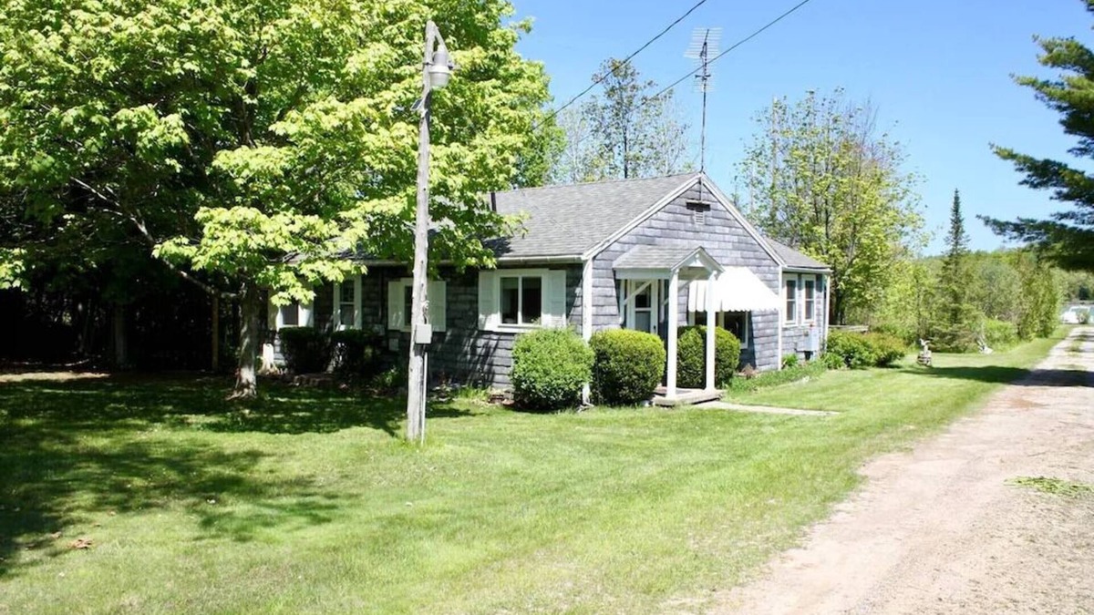 Lake Leelanau Cottage | In the narrows on Lake Leelanau, pet friendly, sleeps 8, and a dock!