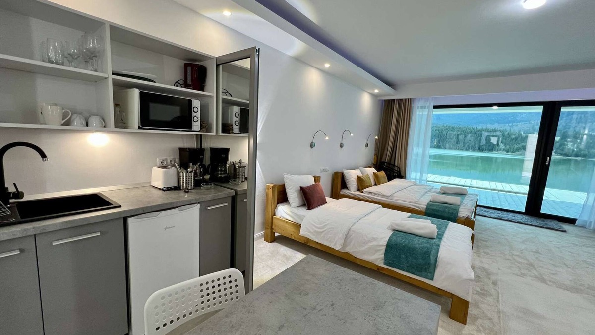 Colibita Apartment | Incredible room with lake view at Lake Colibita, next to the lake.