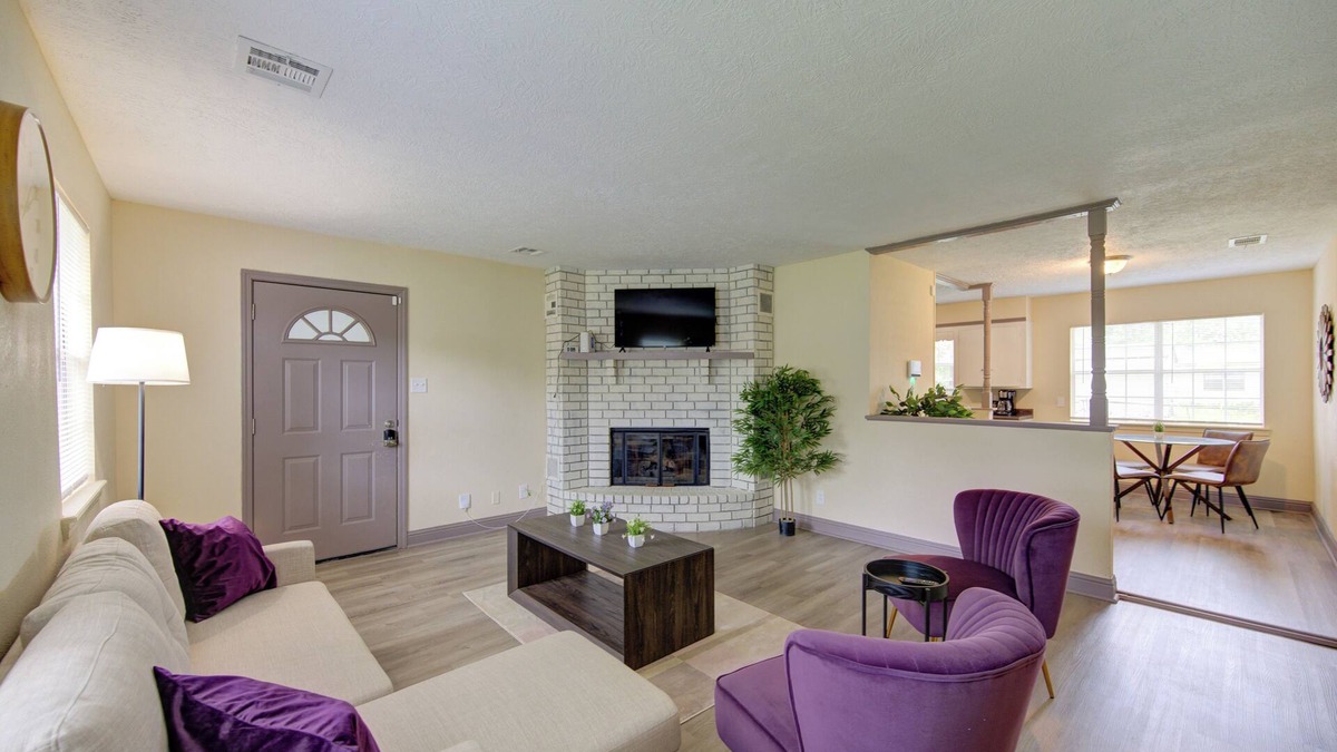 Beaumont Apartment | Indoor fireplace with patio and pool table
