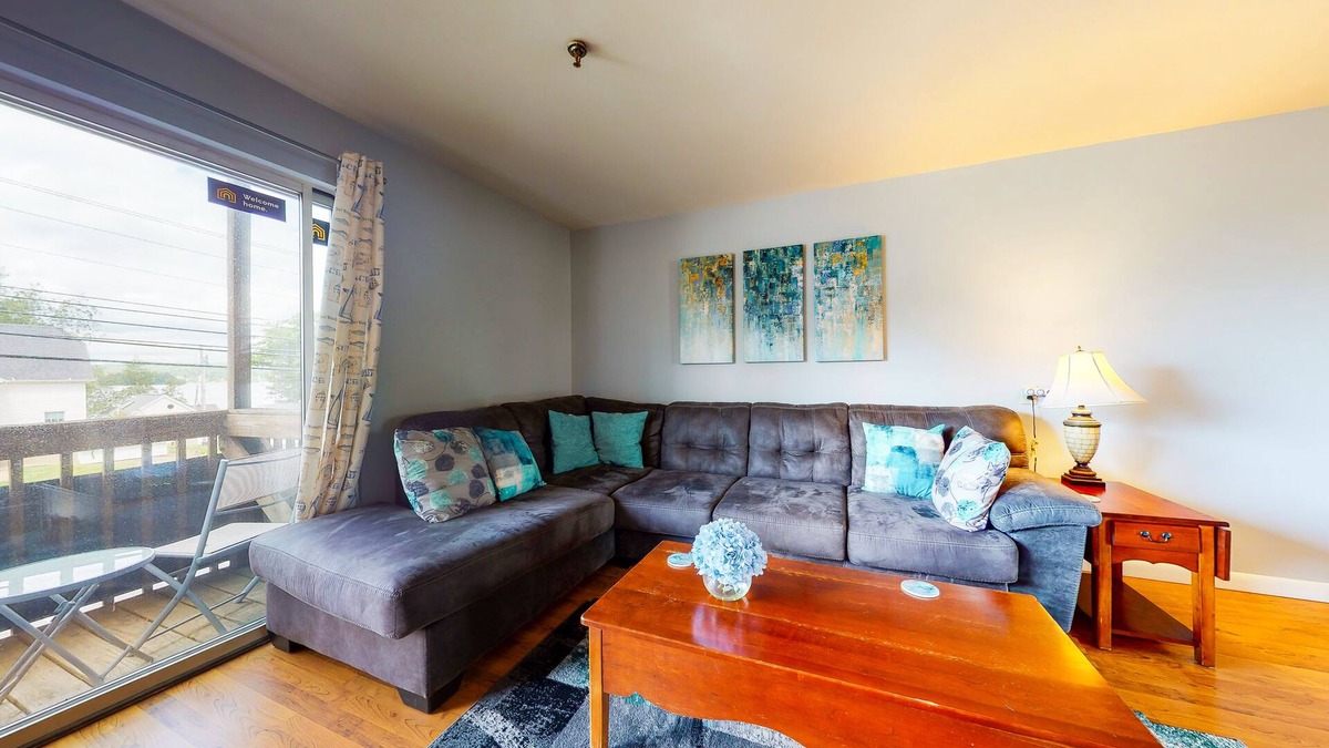 Gilford Condo | Inviting condo in quiet locale with partial lake views, balcony & grilling area