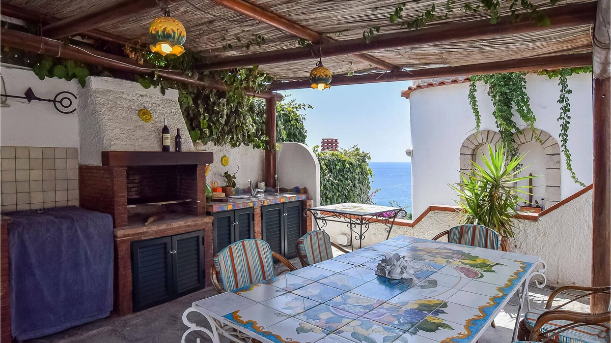 Sant'Angelo House | Inviting cottage with charming outdoor area and limited sea view.