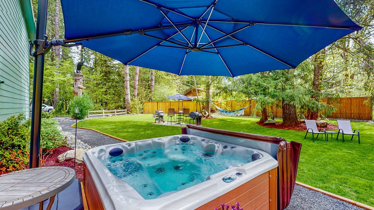 Mason County House | Inviting riverfront home with hot tub, firepit, W/D, & dog-friendly