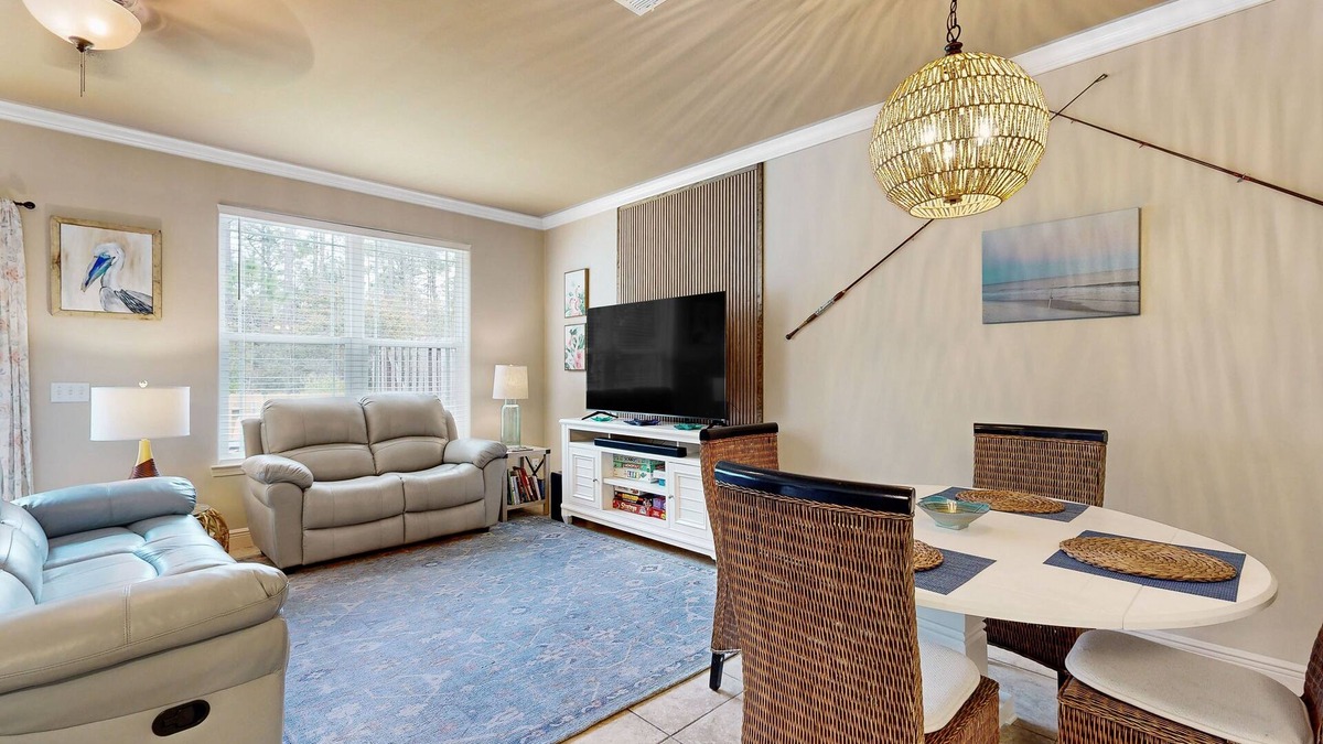 Navarre House | Inviting, two-story home with furnished patio, washer/dryer, & pool access