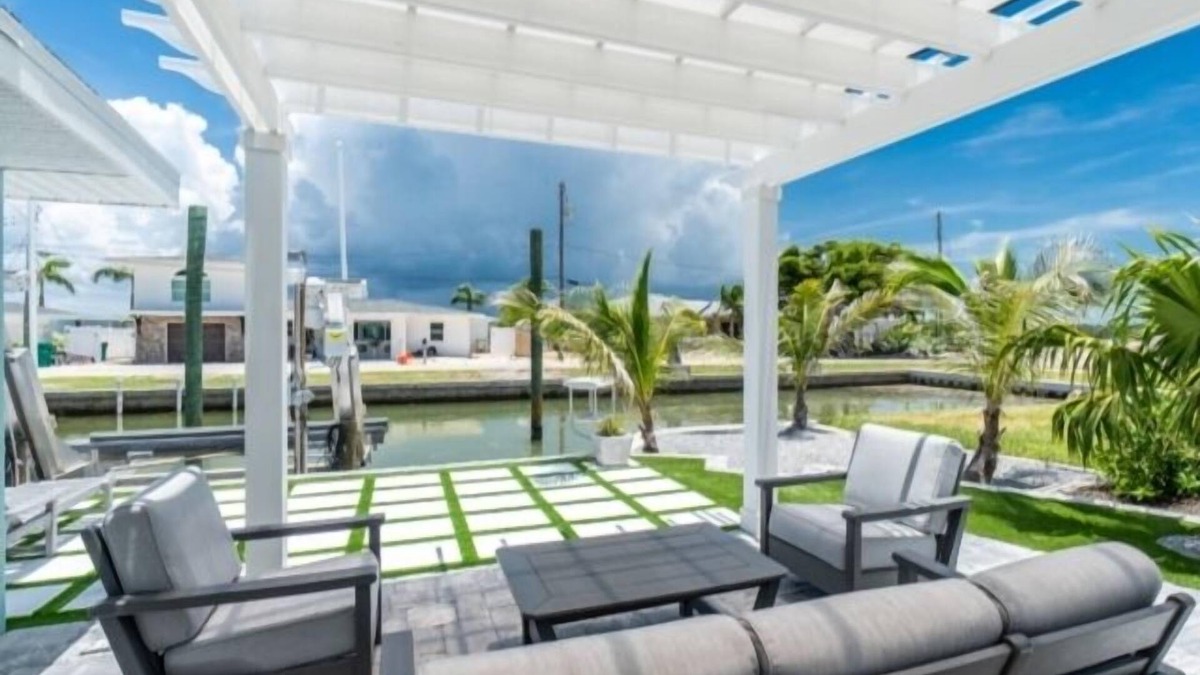 Englewood House | Island charm meets waterfront adventure! Private dock on a deep-water canal with quick Gulf access