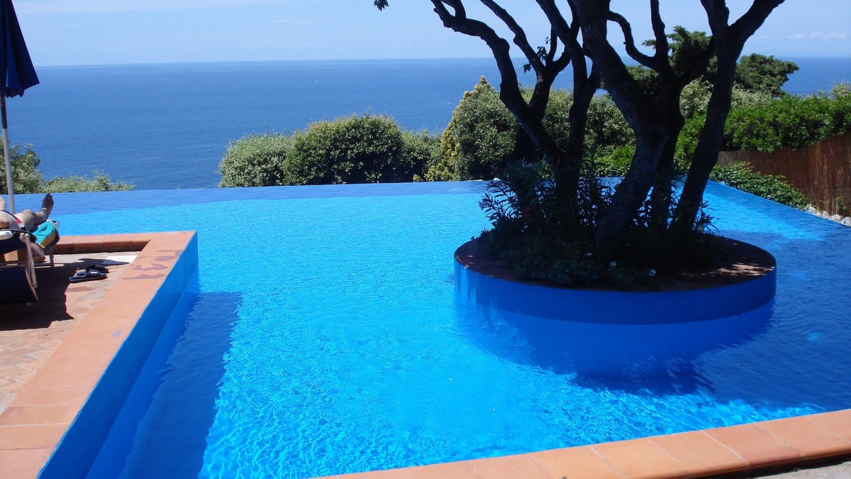 Cala Piccola Apartment | Relax and sea: one room with patio and pool