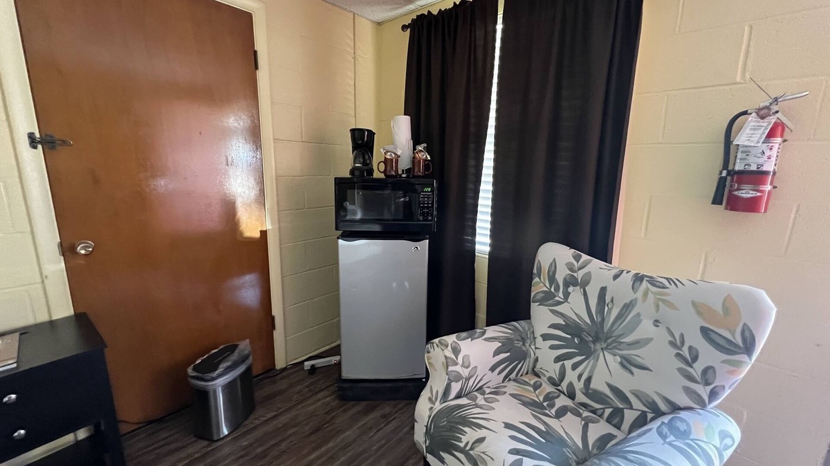 Mount Ida Apartment | JI4, King Guest Room at the Joplin Inn at entrance to the resort by RedAwning