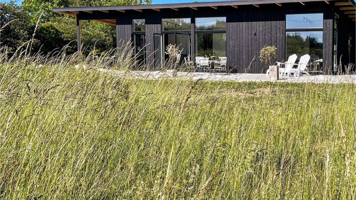 Sodvik House | Just one kilometer from the water, this modern and cozy cottage with a view of the Swedish nature aw