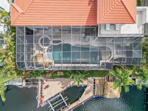 Pelican House | JUST WOW! Experience Luxury! Gulf Access, Pool & Spa, Dock, Tiki- Villa Waterfront Wonderland