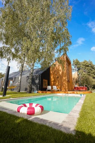 Dabrowno House | Kalbornia LAKE & POOL HOUSE by JWPM