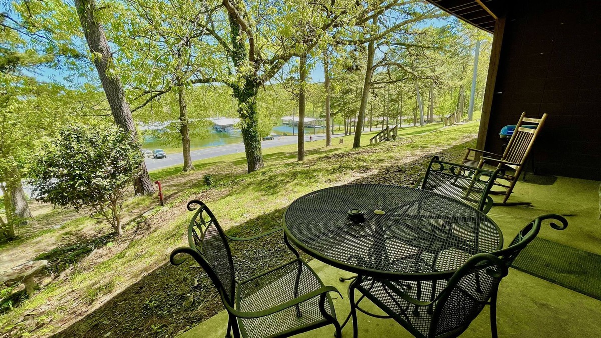 Mount Ida Apartment | King Studio with king bed, dining area, sleeper sofa and view of Lake Ouachita by RedAwning
