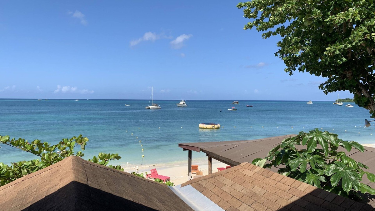 Negril Villa | King Suite at Oceanview Resort in Jamaica - Enjoy 7 miles of White Sand Beach! by RedAwning