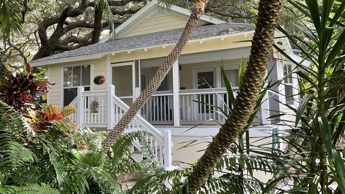 New Smyrna Beach Cottage | Kingfisher Cottage on Canal and two blocks to Ocean, amidst a tropical landscape