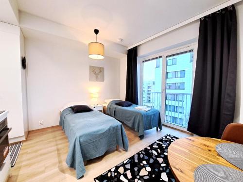 Tampere Apartment | Kotimaailma Apartments - Moderni ydinkeskustan yksiö - Aleksanterinkatu
