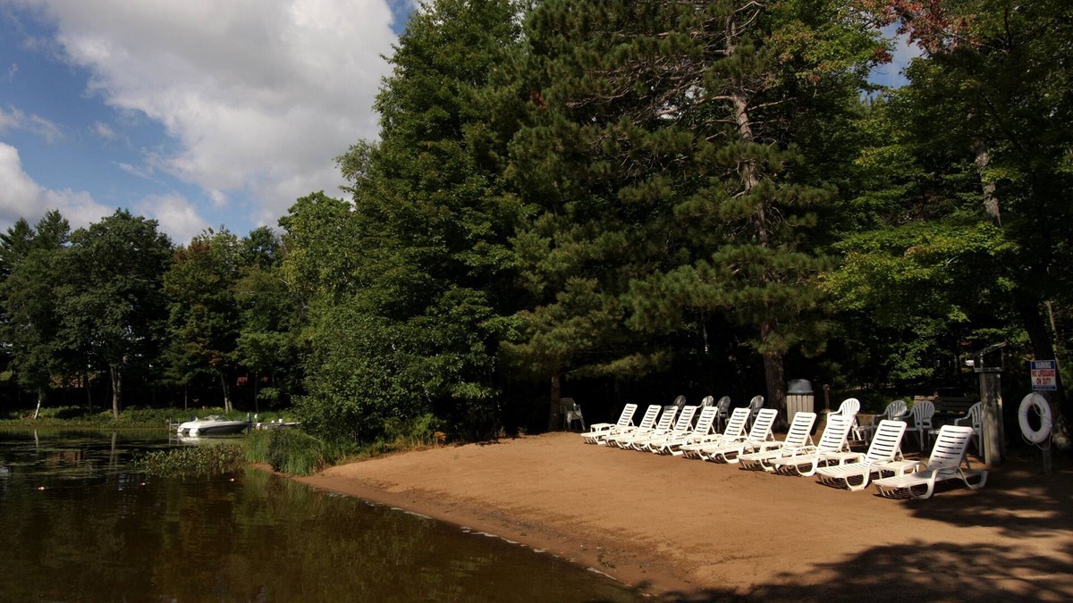 Eagle River Condo | Lake Forest Resort – Relax on a Pristine Sandy Beach in the Northwoods!