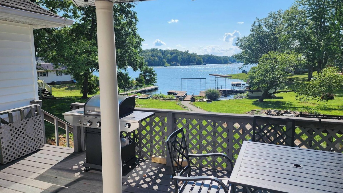 Marion House | Lake Front home Sleeps 10 Overlooking deck for perfect lake views & a coffee bar