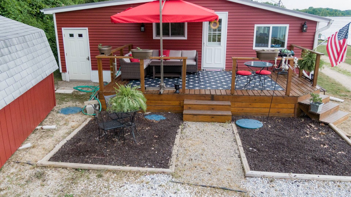 Dowling Cottage | Lake front property with a relaxing front deck overlooking Bristol Lake