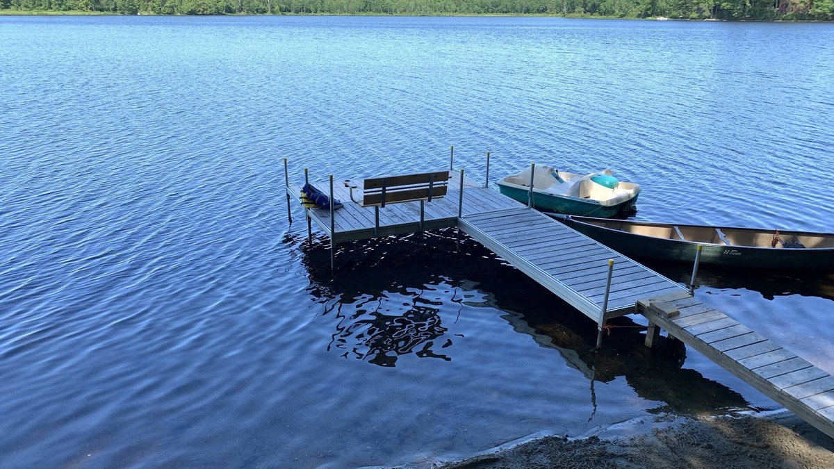 North Jay Cottage | Lake House with Swim Area, Dock, Deck, Canoe, & Paddle Boat - 1BR+, Sleeps 4-6